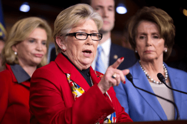 Former U.S. Rep. Carolyn McCarthy speaks as House Minority Leader Pelosi listens during a news conference on Capitol Hill in Washington in 2012.